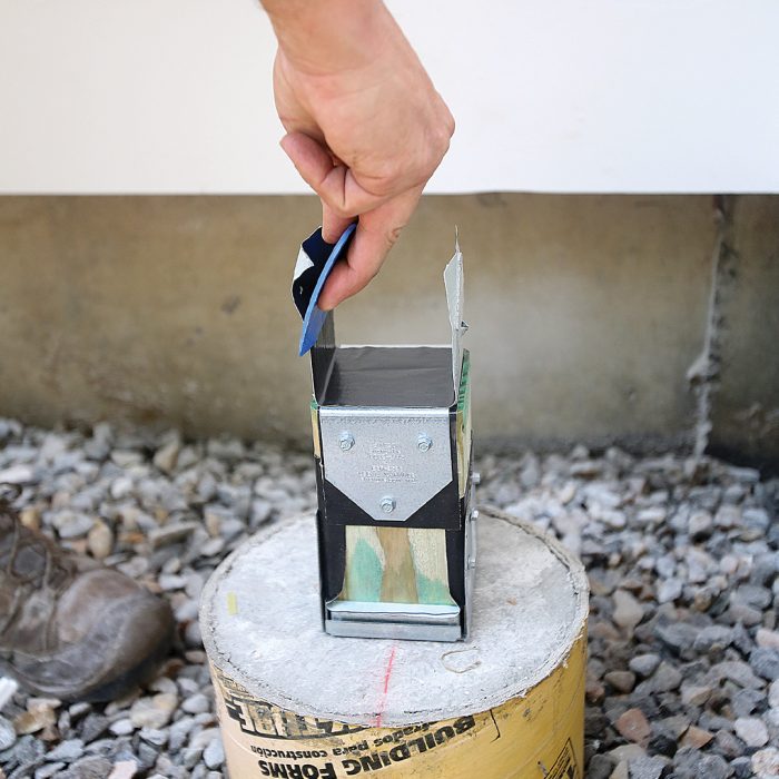 Hand wrapping the inside of each cap with flashing tape.