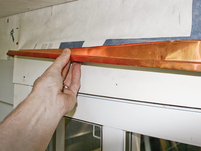 Install metal drip cap