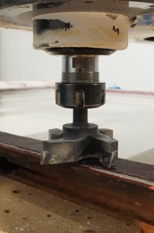 A cutter with replaceable blades flattens the exterior of the sash.